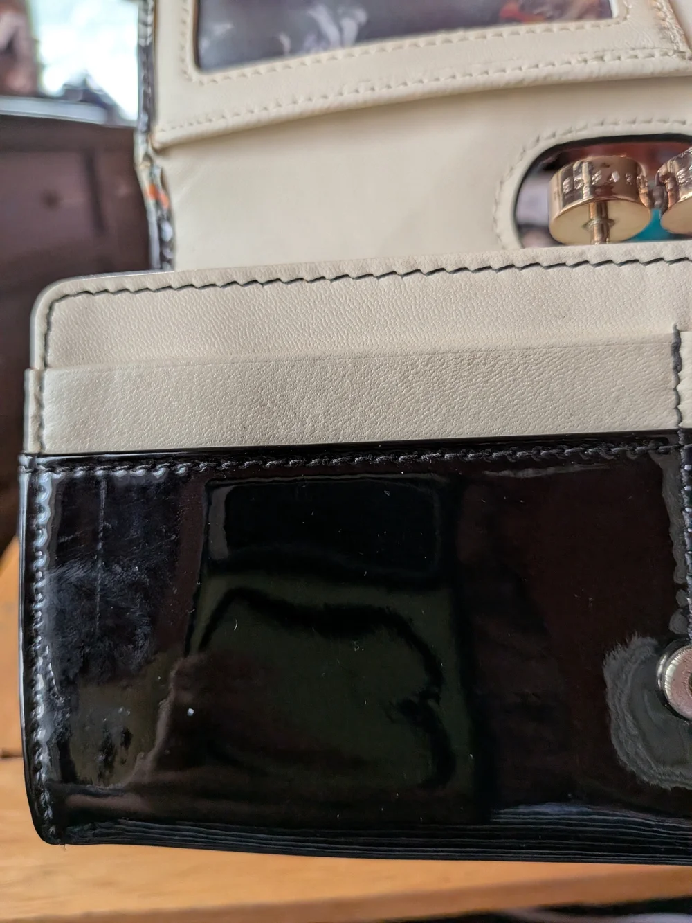 Ted Baker Black Wallet with White Dog Print and Orange Accents